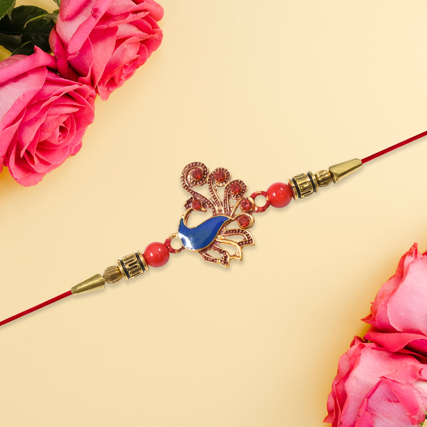 Ethnic Peacock Rakhi With Stone Detailing Ethnic Peacock Rakhi With Stone Detailing
